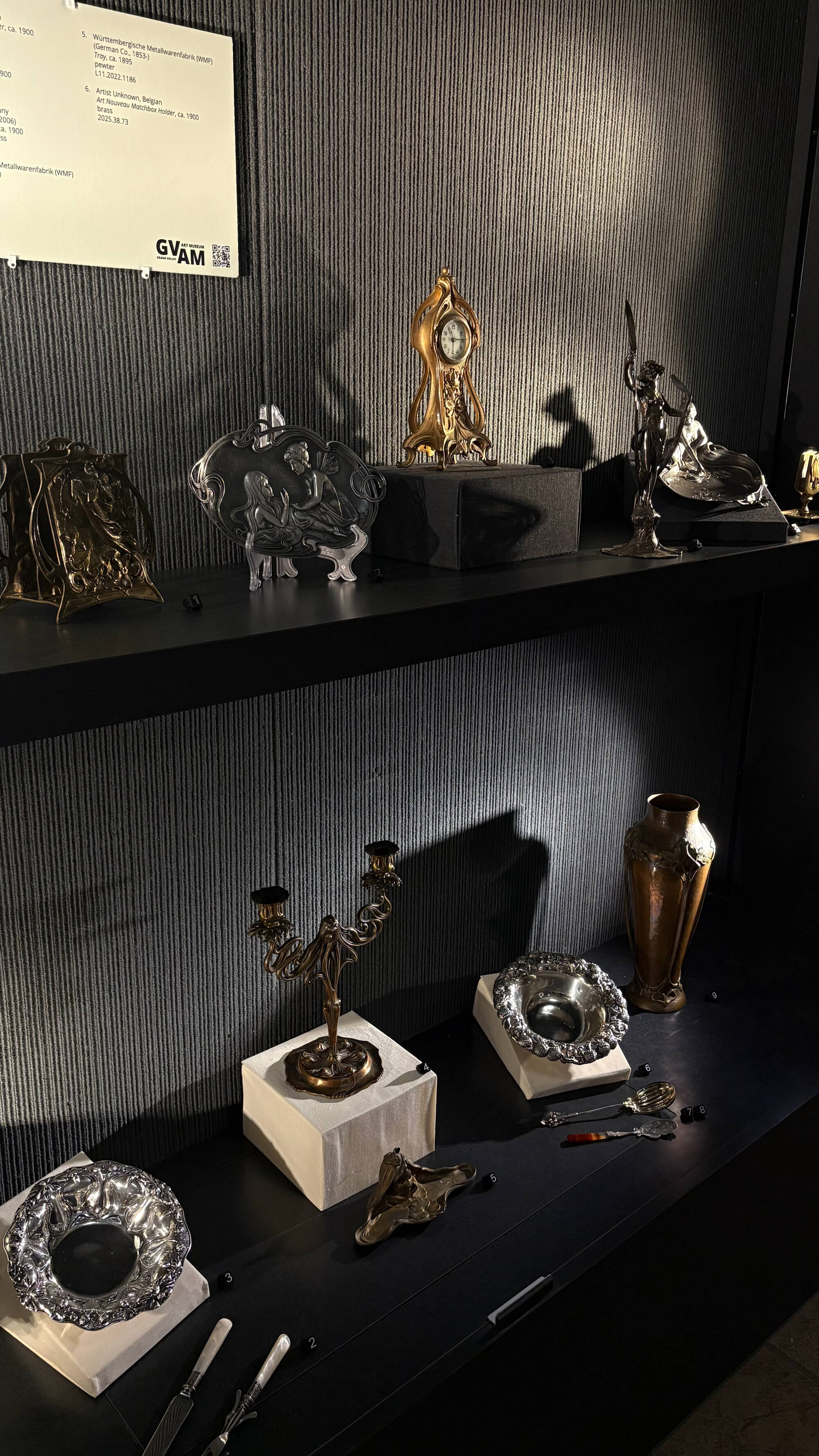 Interior of the case showcasing the exhibition, La Danse des Métaux